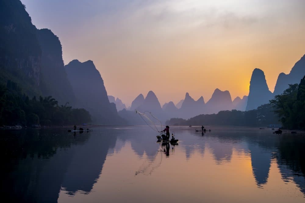 Golden Hour River Fishing by Mieke Suharini — canvas wall art