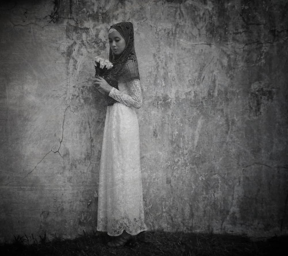 Pensive Girl With Flowers by Kahar Lagaa — canvas wall art