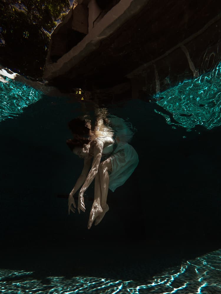 Woman Floating Underwater by Thanakorn Chai Telan — canvas wall art