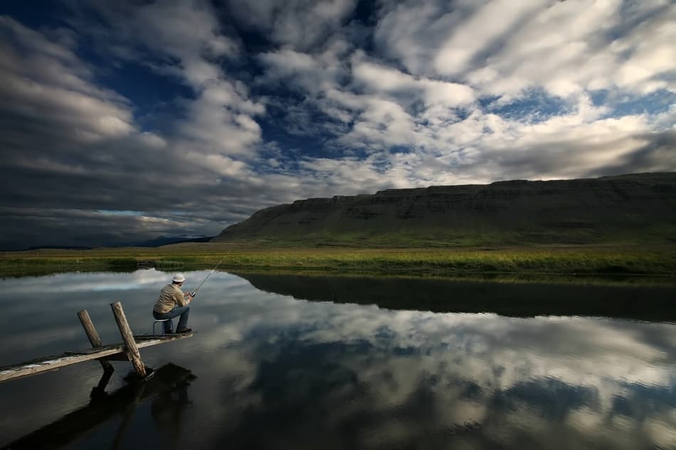 Angler Under Dramatic Sky by Bragi Ingibergsson - BRIN — canvas wall art