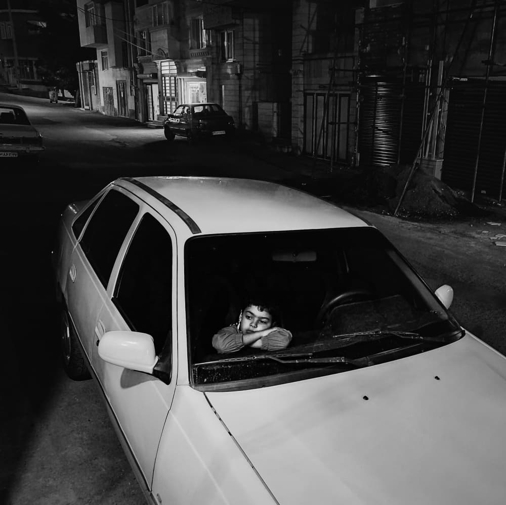 Pensive Child in Car by Shamal Shakibayi — canvas wall art