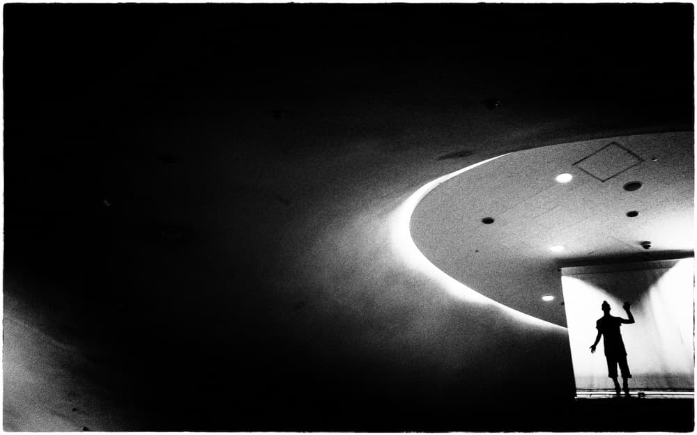 Man Beneath Curved Light by Parole Kim — canvas wall art