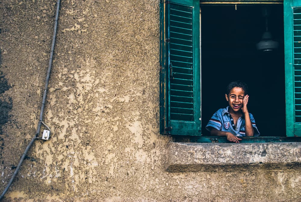 Happy Boy Green Shutters by Mohamed Kazzaz — canvas wall art