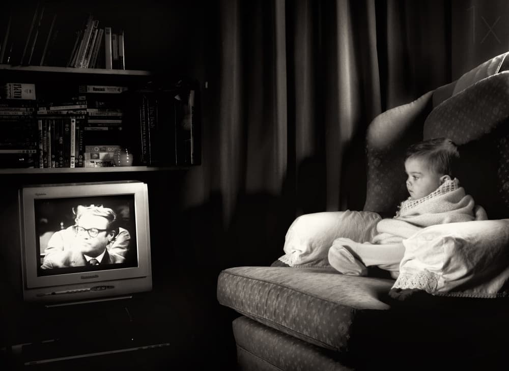 Cozy Infant Watching TV by Lorenzo Grifantini — canvas wall art