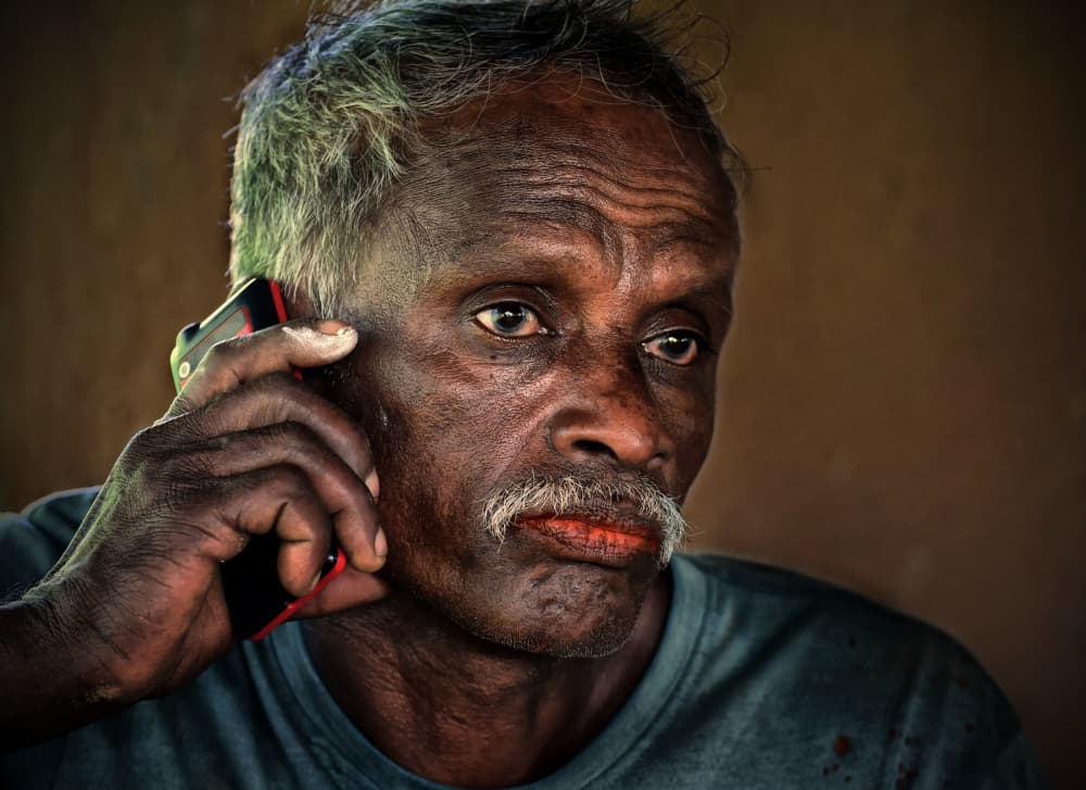Older Man on Phone by Lou Urlings — canvas wall art