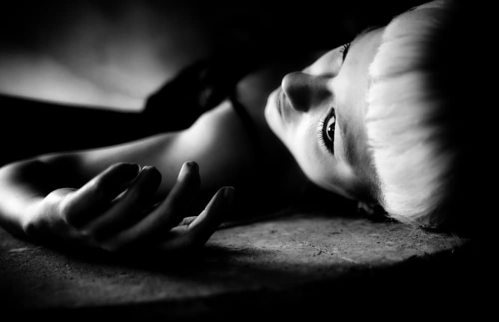 Blonde Woman's Upward Gaze by Erkan Camlilar — canvas wall art