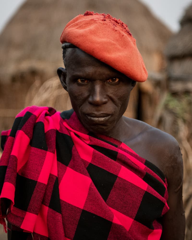 African Man Red Beret by Max Vere-Hodge — canvas wall art