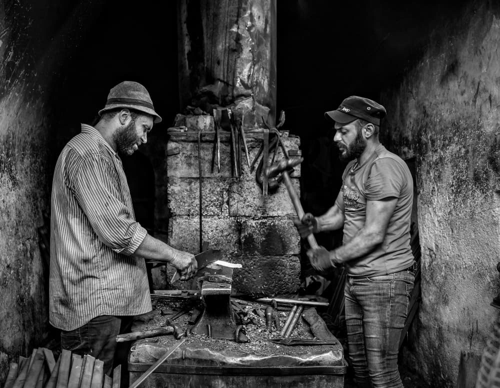 Blacksmiths At Work by Bashar Alsofey — canvas wall art