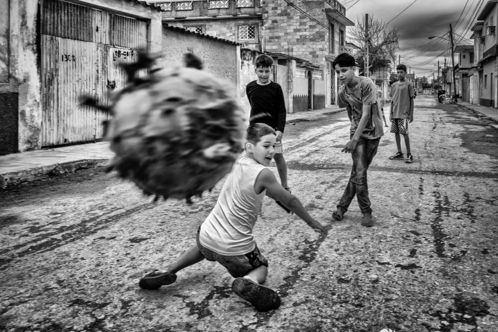 Boys Street Game Action by Andy Bauer — canvas wall art