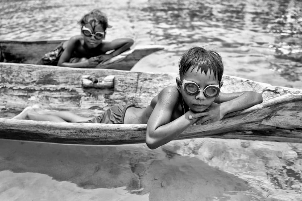 Curious Boys In Boat by Kieron Long — canvas wall art