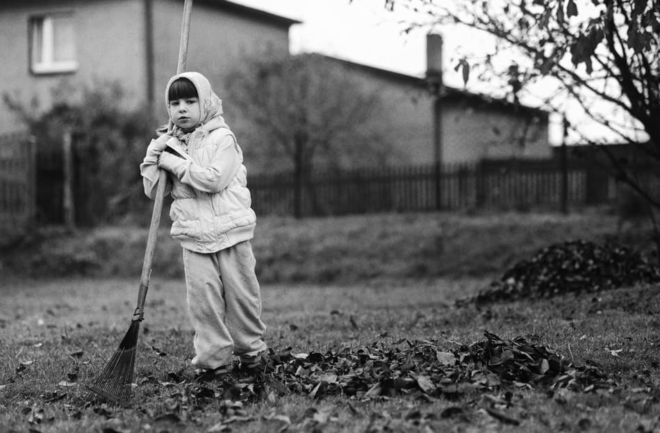 Little Girl Raking Leaves by Monique — canvas wall art