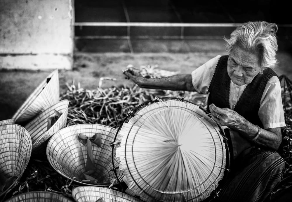Elderly Woman Weaves Hats by John Yuk Kong Chung — canvas wall art