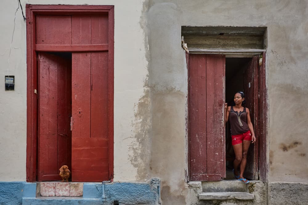 Woman Red Doorway by Avital Hershkovitz — canvas wall art