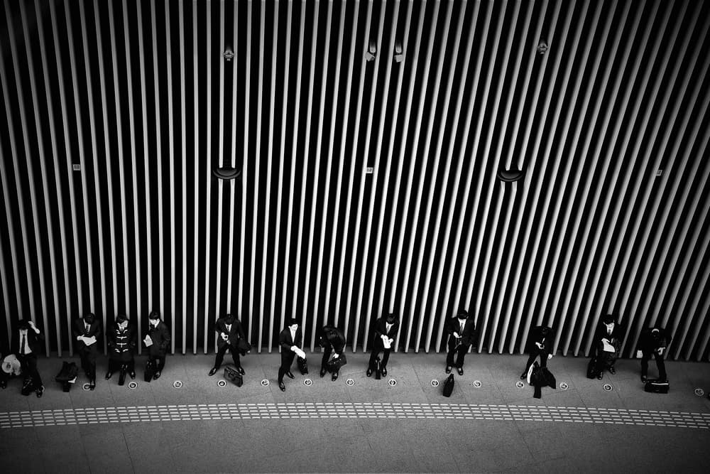 Urban Commuters Waiting by Reiko kiri — canvas wall art