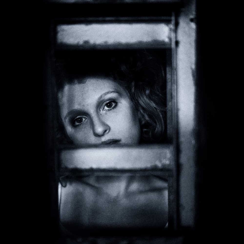 Intense Gaze Through Window by Yuri Shepelev — canvas wall art