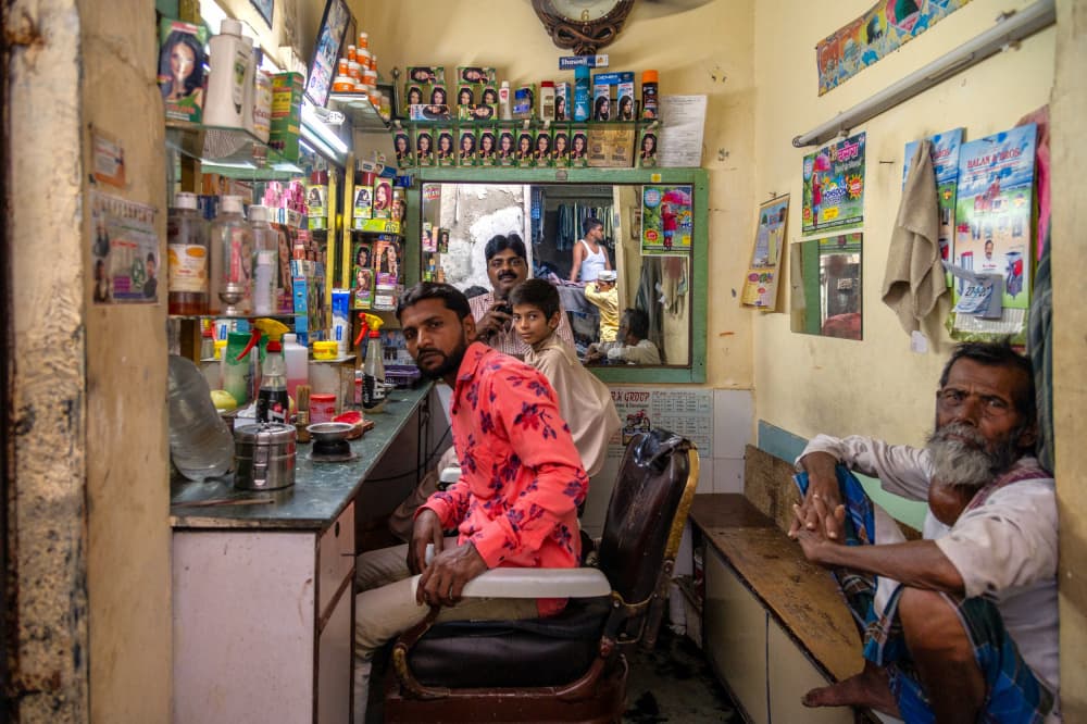 Indian Barbershop Scene by Ilana Lam — canvas wall art