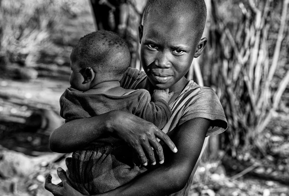 Pensive African Siblings by Joxe Inazio Kuesta Garmendia — canvas wall art