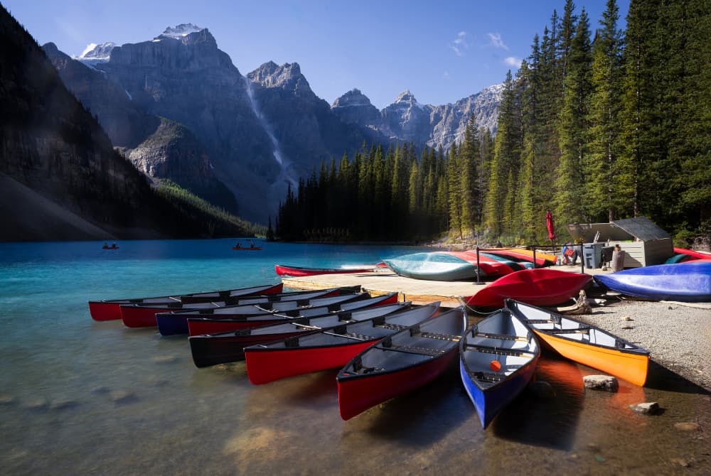 Turquoise Lake Canoes by Weihong  Liu — canvas wall art