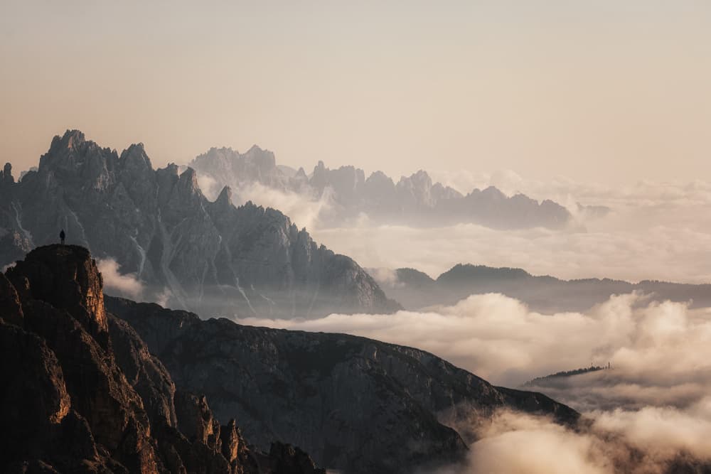 Hiker Above Golden Clouds by Uschi Hermann — canvas wall art