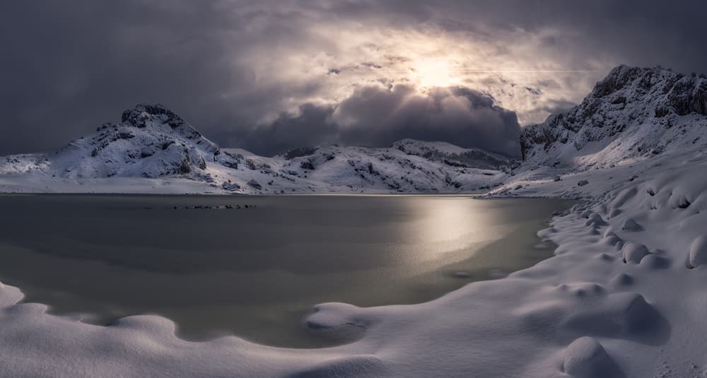 Snowy Mountain Lake Sunlight by Juan I. Cuadrado — canvas wall art
