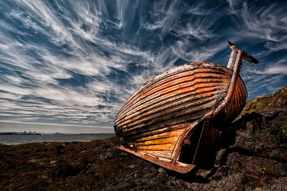 Rusty Boat Dramatic Sky by Þorsteinn H. Ingibergsson — canvas wall art