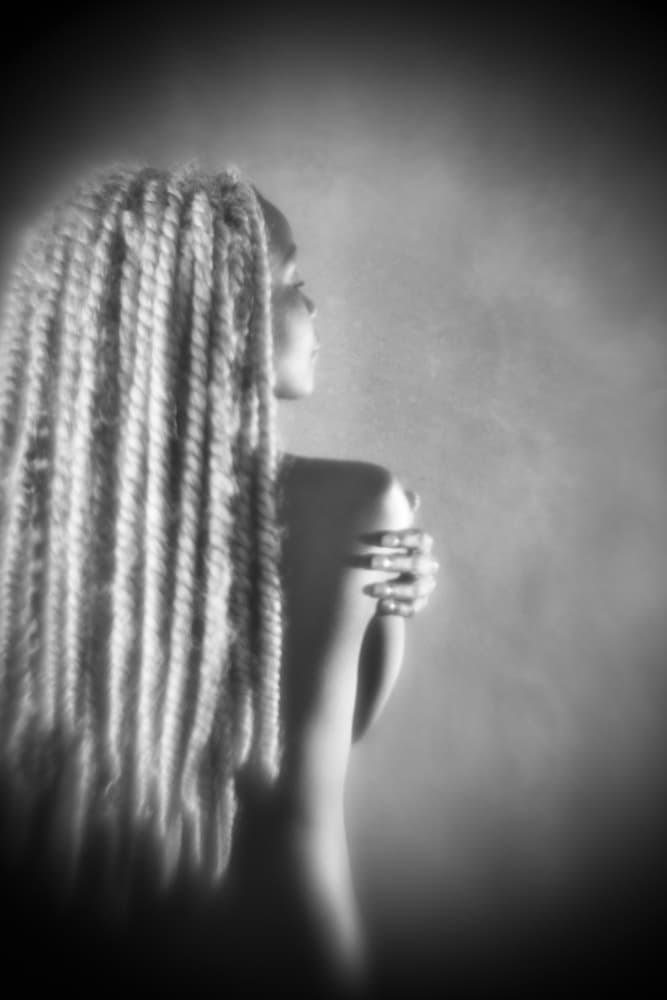 Elegant Woman with Braids by Mel Brackstone — canvas wall art