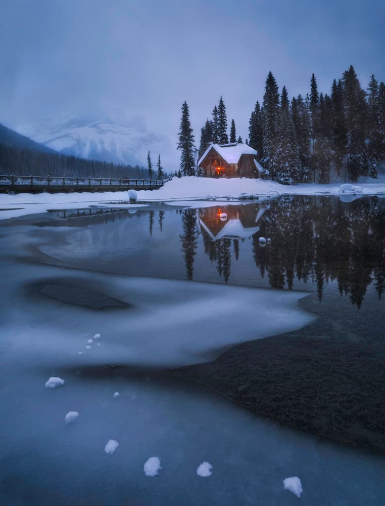 Cozy Winter Cabin Reflection by Jenny L. Zhang — canvas wall art