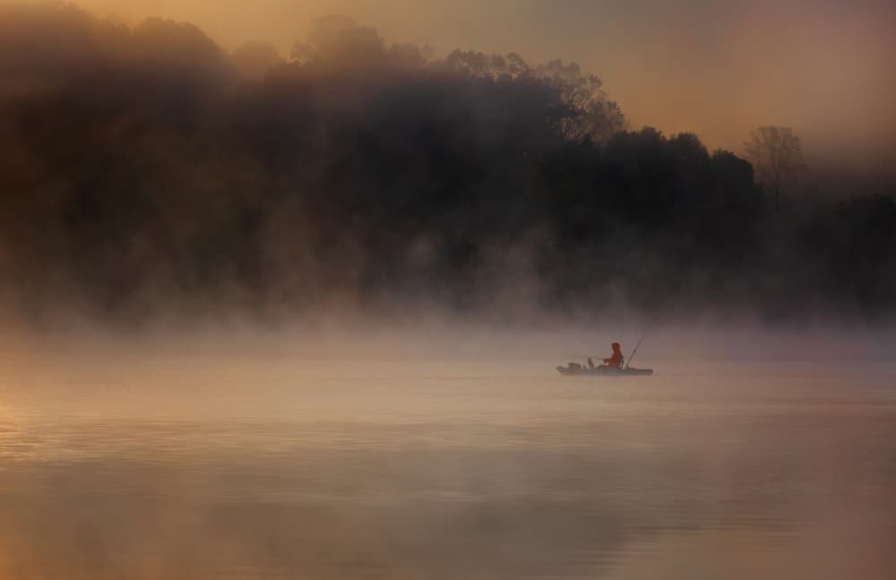 Misty Morning Kayak Fishing by Yuzheng Ren — canvas wall art