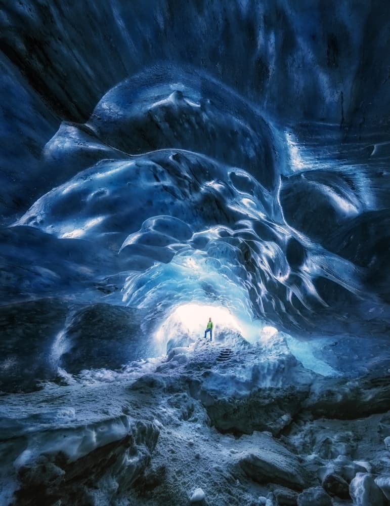 Blue Ice Cave Explorer by joanaduenas — canvas wall art