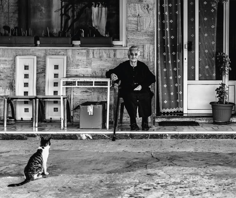 Old Woman Porch Cat by Ömer Ates Kızıltug — canvas wall art
