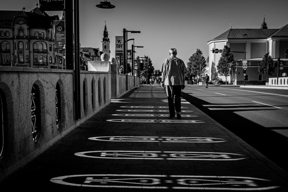 Man Walking City Shadows by Raul Ghiman — canvas wall art