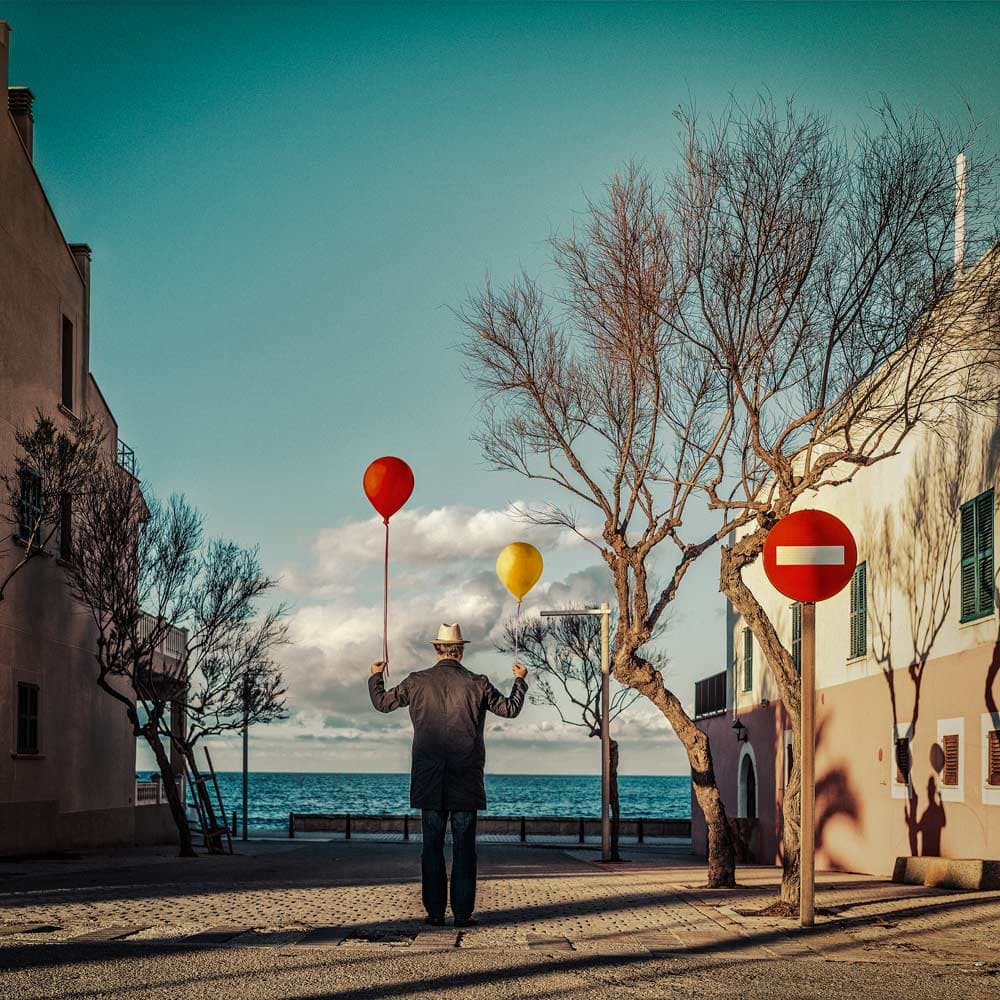 Man and Coastal Balloons by ambra — canvas wall art