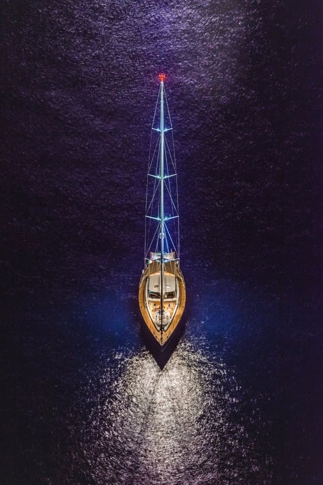 Luminous Night Sailboat by Mario Coppola — canvas wall art