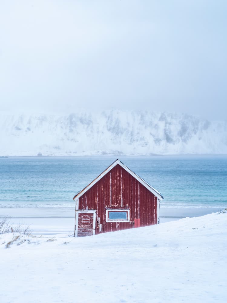 Red Cabin Winter Beach by Stefan Gunnarsson — canvas wall art