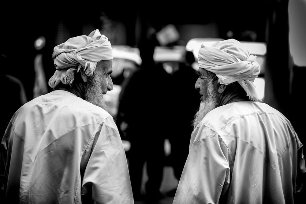Elderly Men Conversing by Akhter Hasan — canvas wall art
