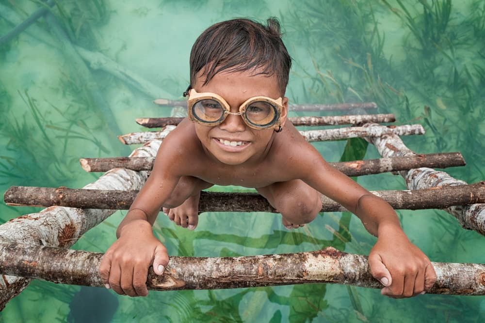 Smiling Boy with Goggles by Muslianshah Masrie — canvas wall art