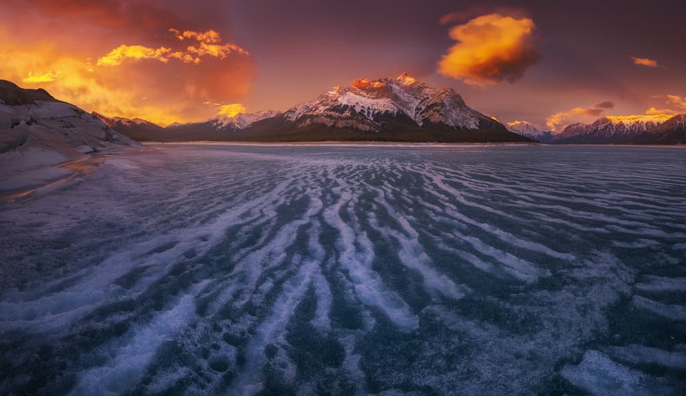 Alpine Sunset Over Frozen Lake by Carlos F. Turienzo — canvas wall art