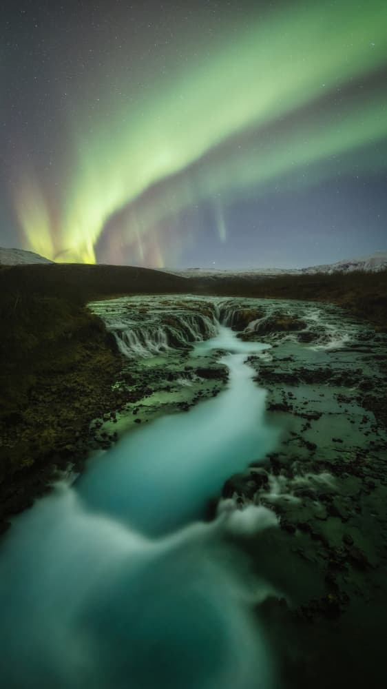 Aurora Over Waterfall by Tomás Hueso Marco — canvas wall art