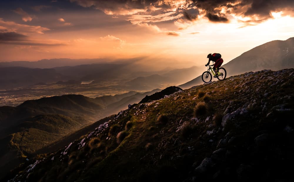Dramatic Mountain Biker Sunset by Sandi Bertoncelj — canvas wall art