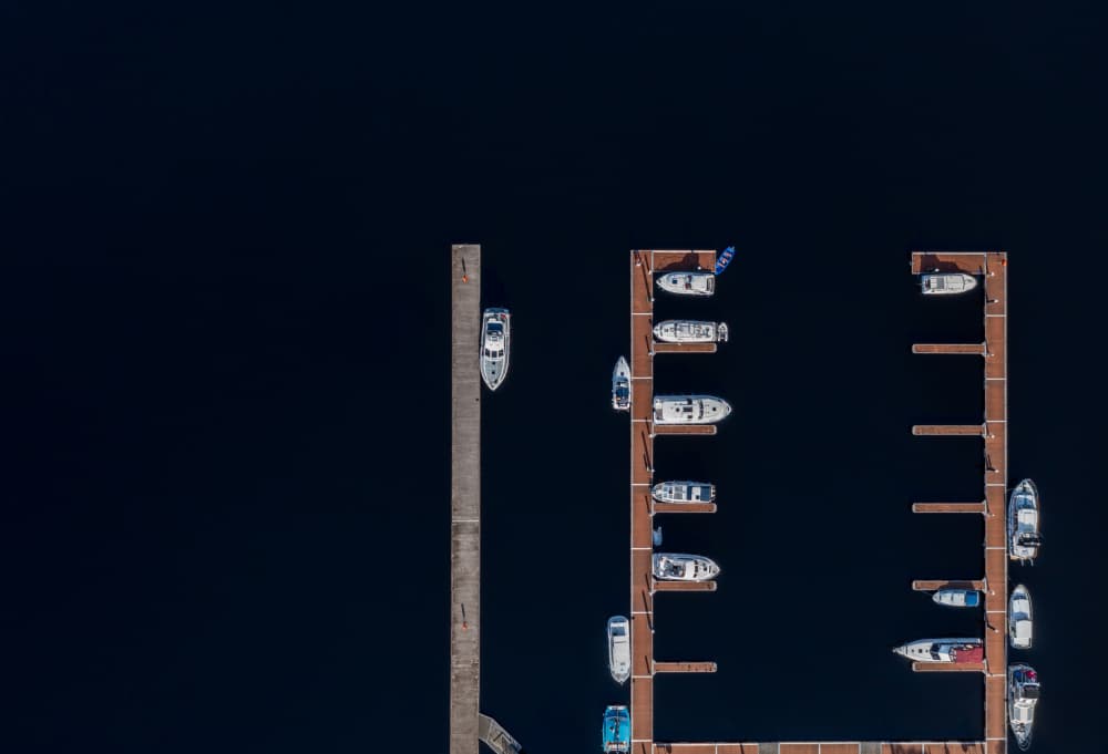 Boats on Dark Water by Srecko Jubic — canvas wall art