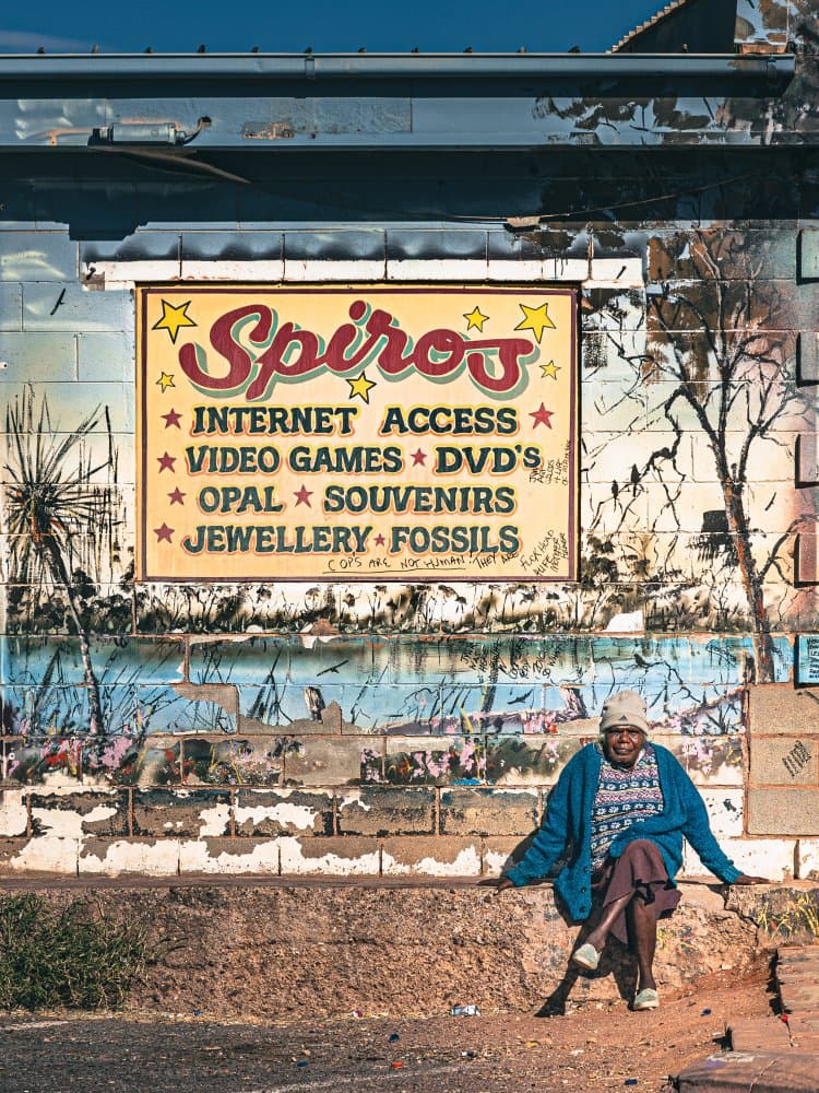 Smiling Woman Desert Shop by Marco Tagliarino — canvas wall art
