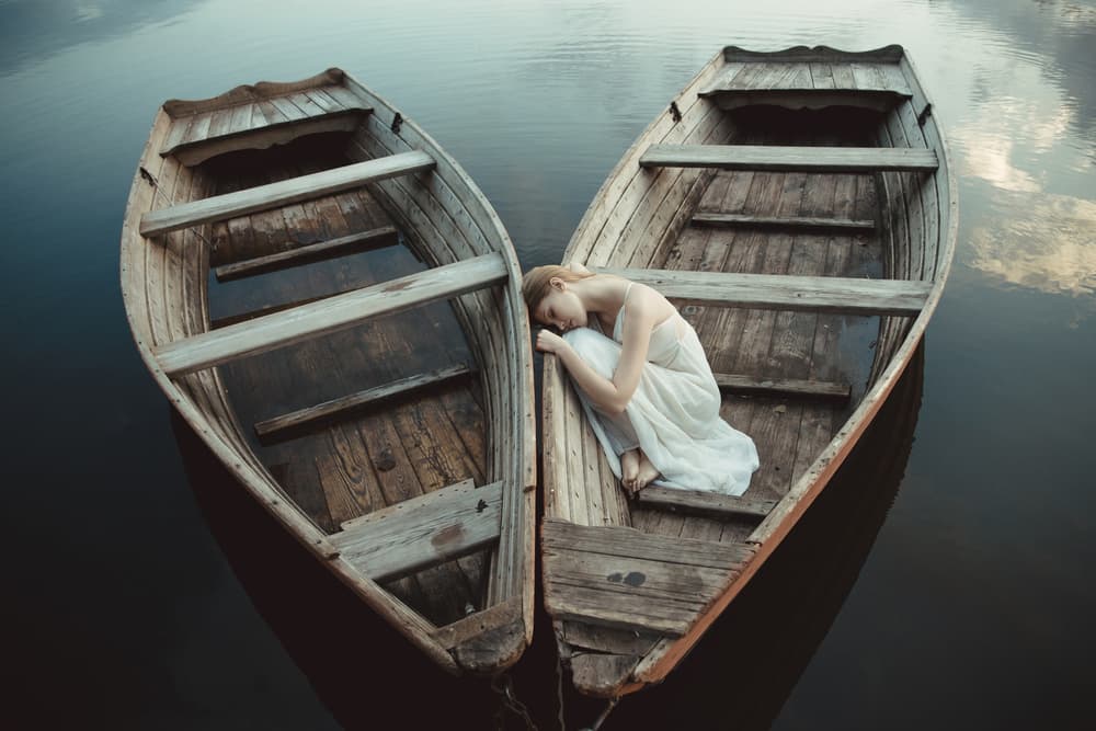 Woman Between Boats by Dorota Gorecka — canvas wall art
