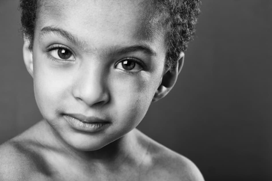 Contemplative Child Portrait by Hesham Alhumaid — canvas wall art