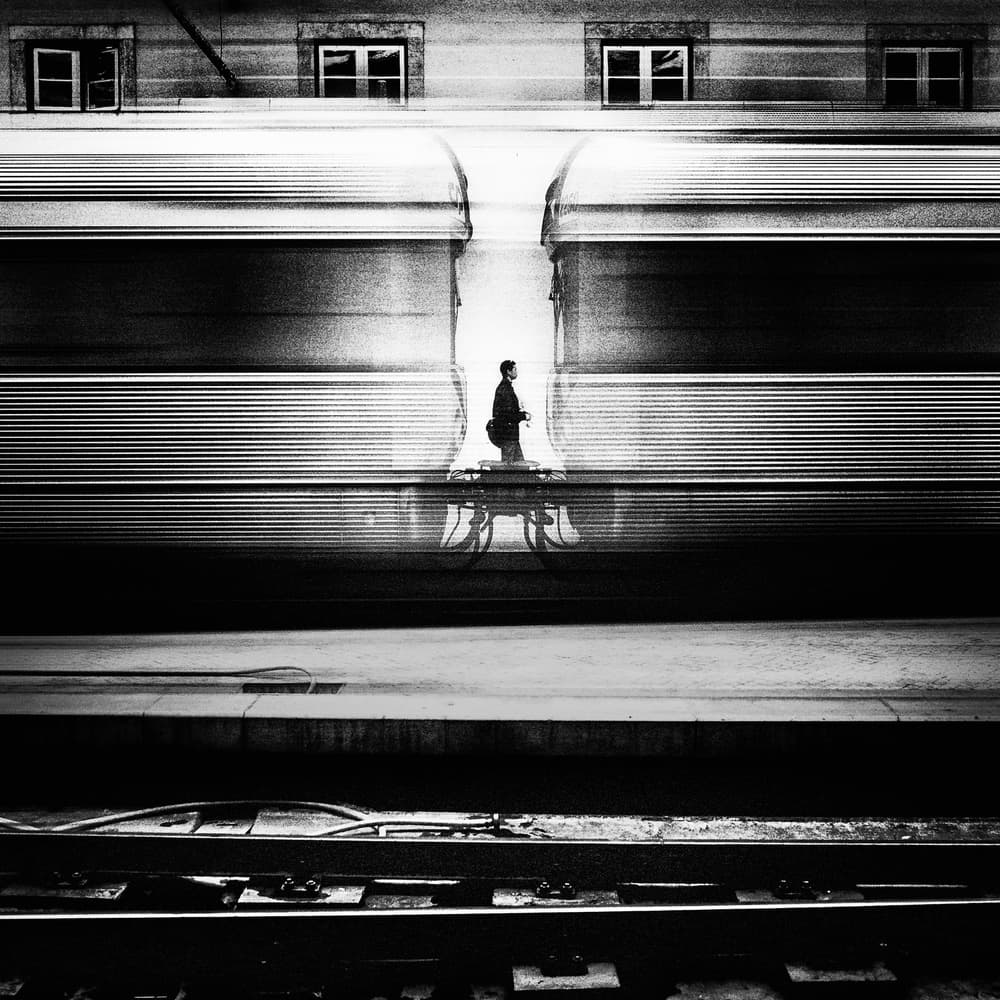 Man Between Trains by Rui Correia — canvas wall art