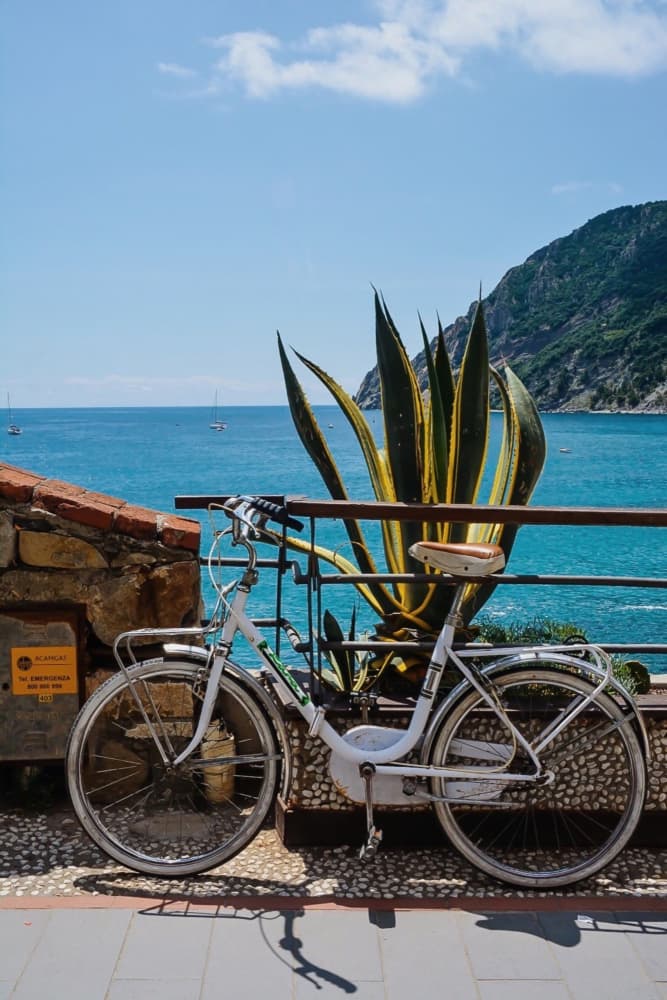 White Bike Blue Sea by Del Mundo Imagery — canvas wall art