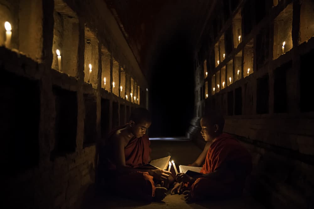 Candlelight Monks Studying by Amnon Eichelberg — canvas wall art