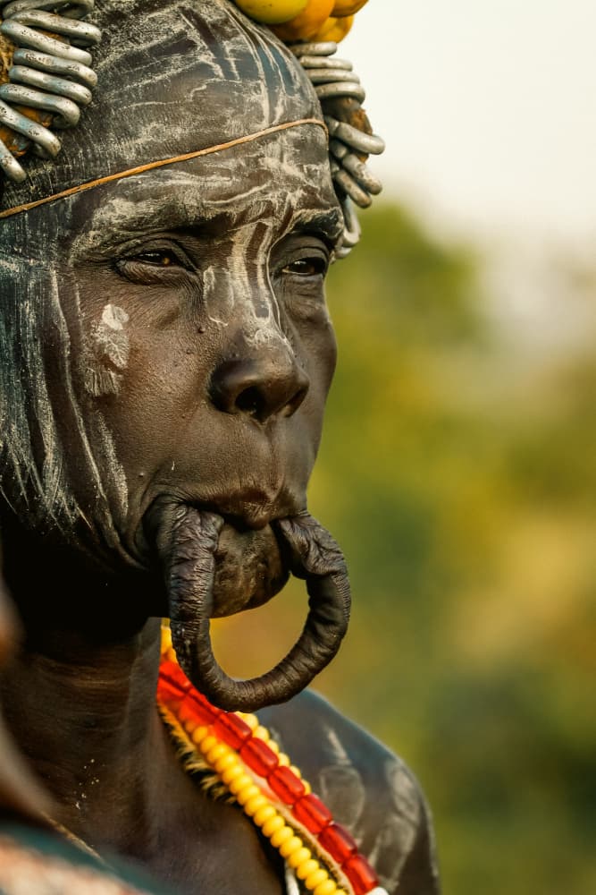 Mursi Woman Portrait by ManginiPhotography — canvas wall art