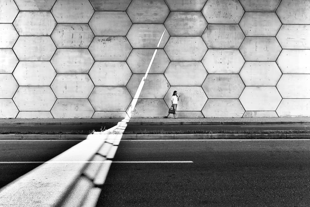 Woman by Hexagon Wall by Jorge Pimenta — canvas wall art