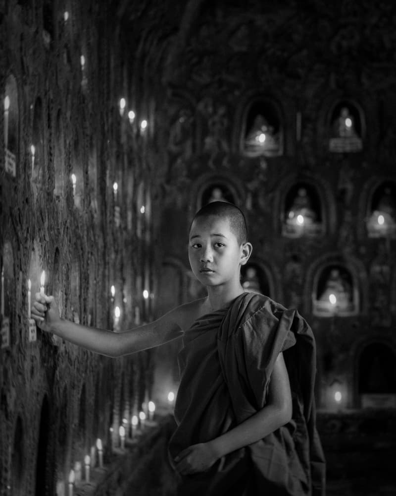 Monk in Candlelit Temple by ADIREK M — canvas wall art