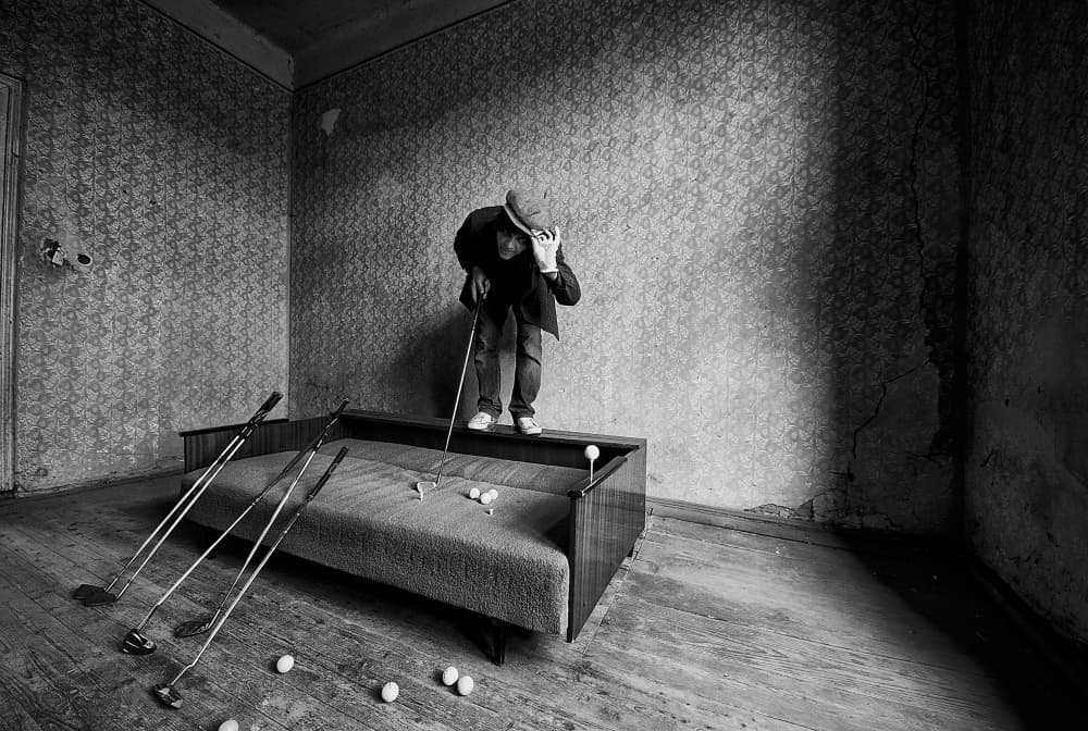 Man Playing Indoor Golf by mario grobenski - psychodaddy — canvas wall art